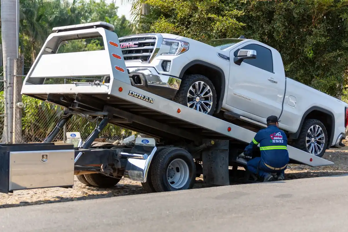Tow truck removing a car from a suburban Bendigo driveway