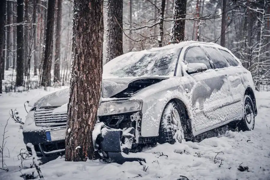 Damaged car recovered after an accident in snowy conditions