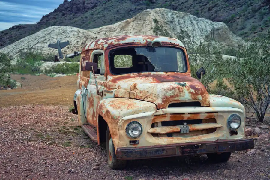 Rusted vintage car ready for scrap vehicle recycling
