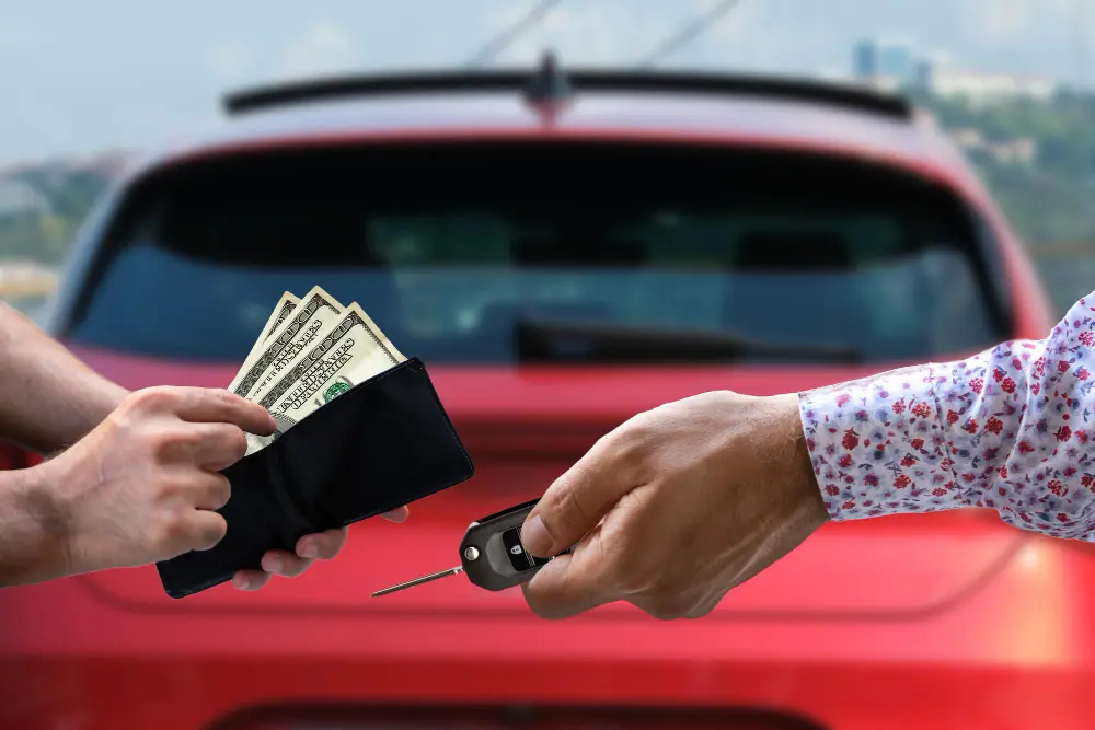Car owner receiving cash for selling a vehicle in Bendigo